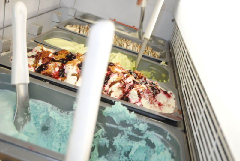 Home made bubblegum, cream tea and applie pie ice creams in the cabinet at Rays Ice Cream
